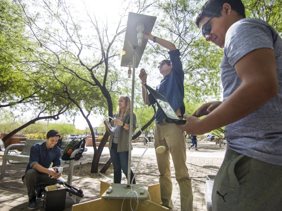 Group of students setting up a photo shoot