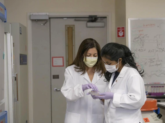 Meenu Priya (right) spent the fall semester working in the lab of Yana Zavros, PhD, (left).