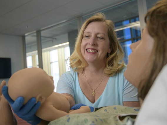 Erin McMahon, director of the nurse-midwifery program, in a hospital setting.