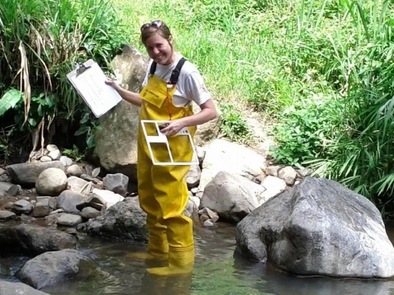 Woman standing in shallow water